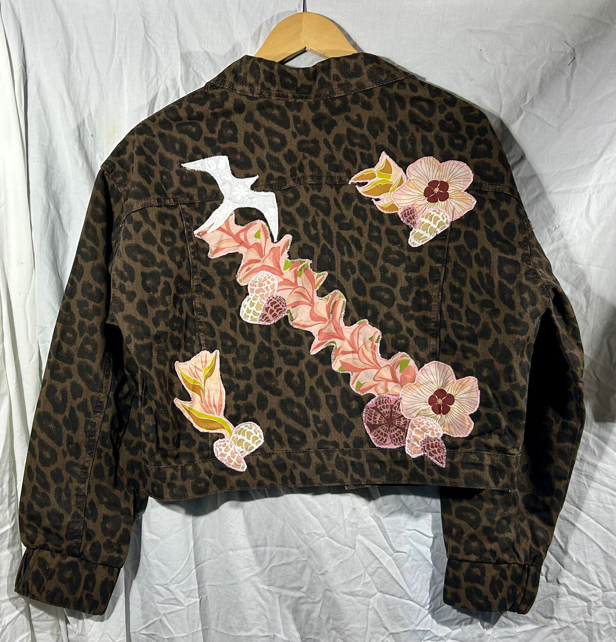 Leopard, leis, shells, and ‘Iwa bird Jacket